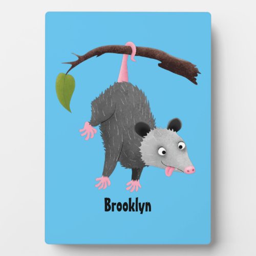 Cute funny opossum hanging from branch cartoon plaque