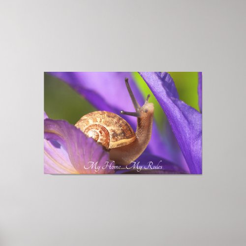 Cute garden snail on purple flower canvas print