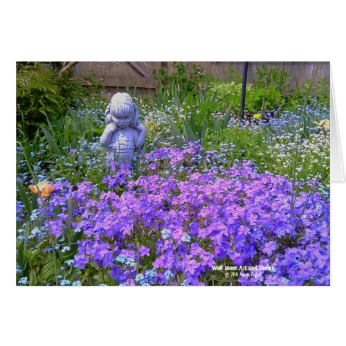 Cute Girl Garden Statue Looking At Purple Flowers
