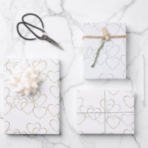 Cute Golden and Silver Heart Charms on White Wrapping Paper Sheets