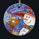Cute Grandson, Snowman & Deer, Christmas Ceramic Ornament<br><div class="desc">For your little grandson this Christmas, give a gift of this adorable Christmas ceramic ornament. It features a sweet little reindeer with huge eyes looking up at a very festive snowman. The two are nose to nose with each other. Personalize the front with your grandson's name, and the back with...</div>