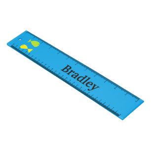 Cute green and yellow fishes on blue ruler