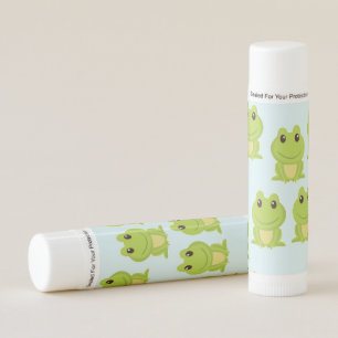 Cute green frogs on blue lip balm