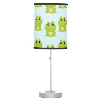 Cute green frogs on blue