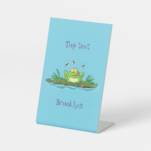 Cute green hungry frog cartoon illustration pedestal sign