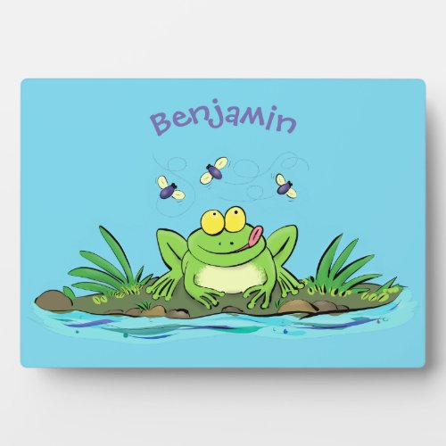 Cute green hungry frog cartoon illustration plaque