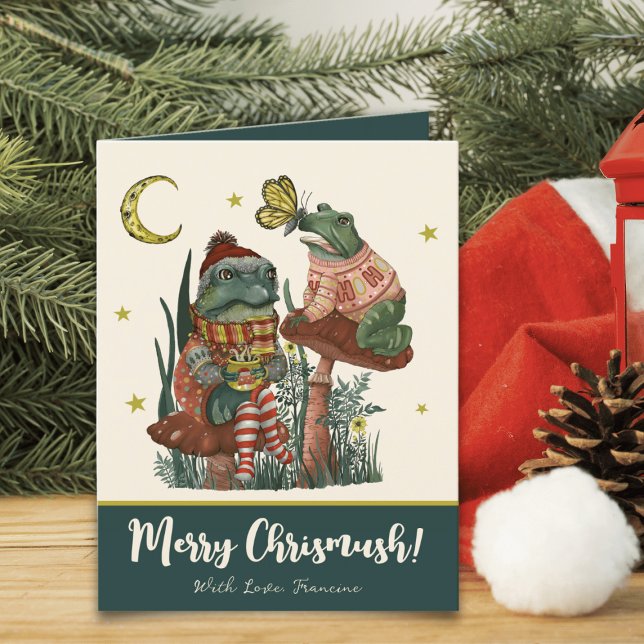 Cute Green Mushroom Frog and Toad Merry Christmas  Holiday Card (Whimsical Merry Christmas card with an illustration of frogs sitting on mushrooms drinking cocoa)
