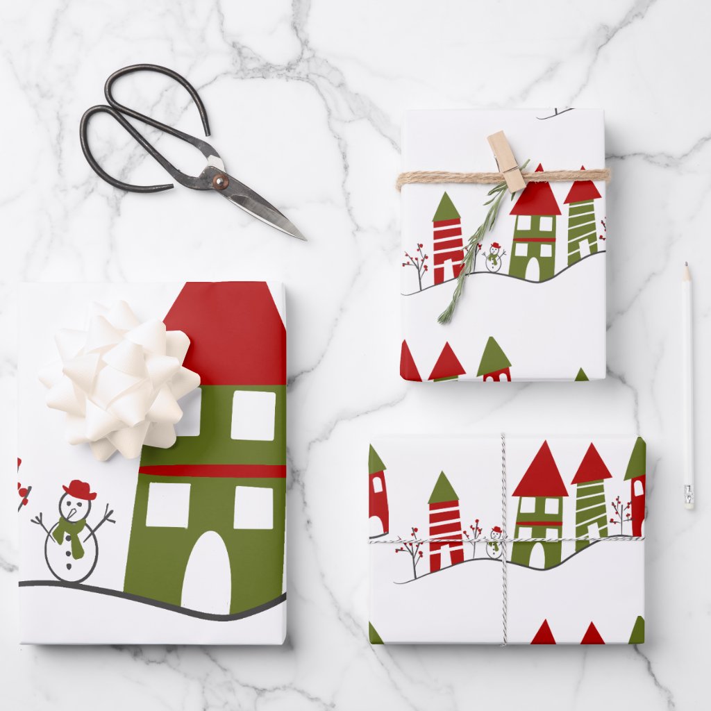 Cute green&red village in the snow at Christmas