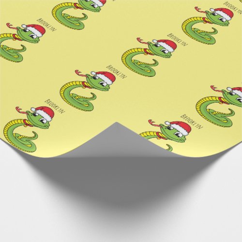Cute green snake with santa hat cartoon wrapping paper