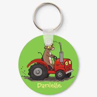 Cute happy cow driving a red tractor cartoon keychain