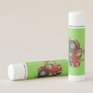 Cute happy cow driving a red tractor cartoon lip balm