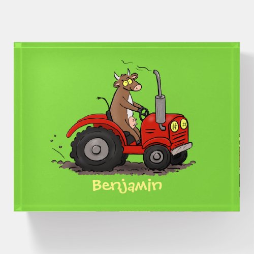 Cute happy cow driving a red tractor cartoon paperweight