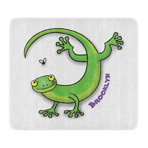 Cute happy green gecko greetings with bug cartoon cutting board