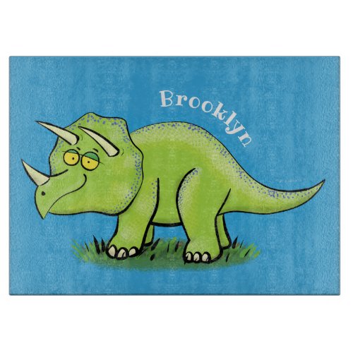 Cute happy green triceratops dinosaur cartoon cutting board