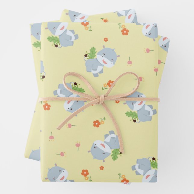 Cute happy hippo with flowers yellow wrapping paper sheets (In situ)