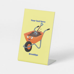 Cute happy orange wheelbarrow cartoon illustration pedestal sign