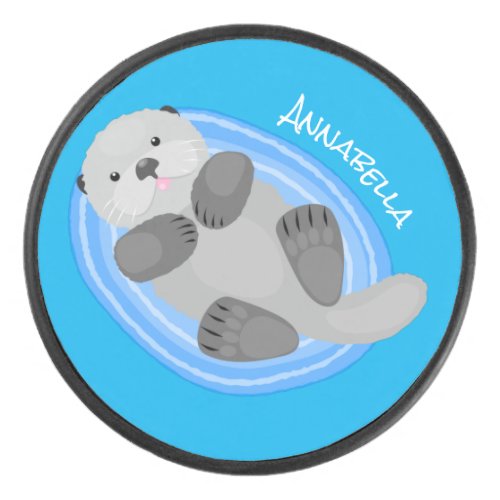 Cute happy sea otter blue cartoon illustration hockey puck