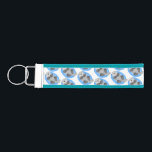 Cute happy sea otter blue cartoon illustration wrist keychain<br><div class="desc">This cute sea otter is resting in the ocean on cool cartoon illustration style. That otter make anyone happy!</div>