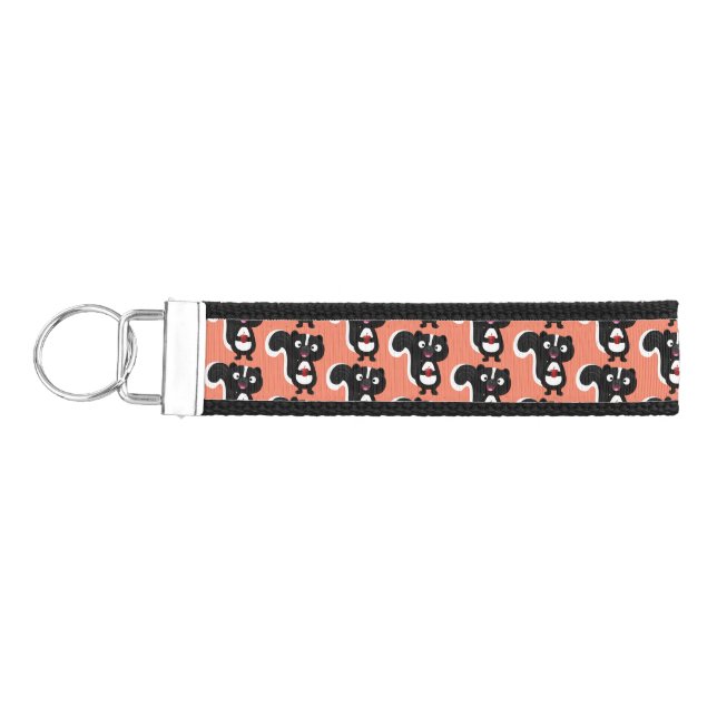 Cute happy skunk cartoon illustration wrist keychain (Keys on Left)