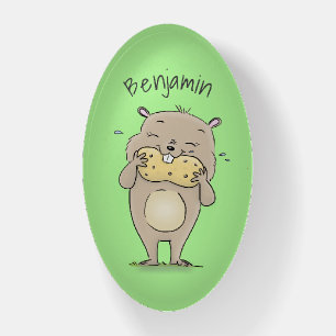 Cute happy smiling hamster with peanut cartoon paperweight