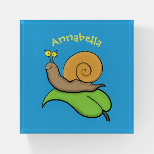 Cute, happy snail on a leaf cartoon illustration paperweight