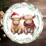 Cute Highland Cow Farm Animals Merry Christmas  Classic Round Sticker<br><div class="desc">Looking for the cutest Christmas cards of the season! Our Highland Cow duo featuring two holiday calves are sure to bring a smile to your loved ones' faces. The design is adorable with the calves wearing a Santa hat and a plaid winter scarf, surrounded by trees and a cozy winter...</div>