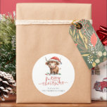 Cute Highland Cow Script name Merry Christmas Classic Round Sticker<br><div class="desc">Cute Highland Cow Script name Merry Christmas . Festive cuteness for your holiday wishes,  with this fun design with a sweet highland cow in his Santa hat. Merry Christmas is in a set stylish script and personalise your name beneath.</div>