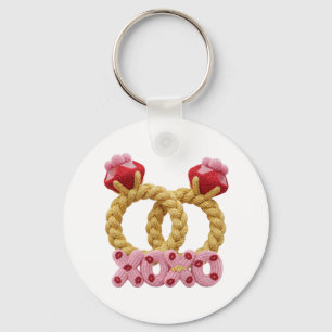 Cute intertwined knitted wedding rings with pink  keychain