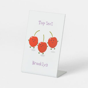 Cute jumping red cherries cartoon illustration pedestal sign