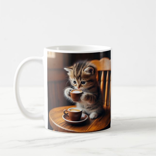 Cute kitten sitting on a chair drinking coffee. coffee mug (Left)