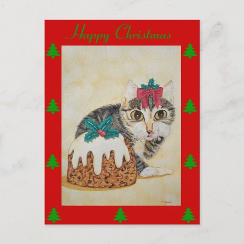 cute kitten tabby cat eating pudding for christmas holiday postcard