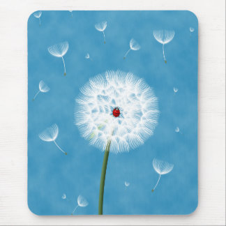 Cute ladybug sitting on top of a dandelion mouse pad