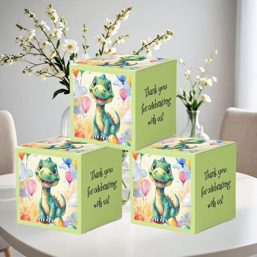 Cute little dinosaur with lots of colorful balloon favor boxes