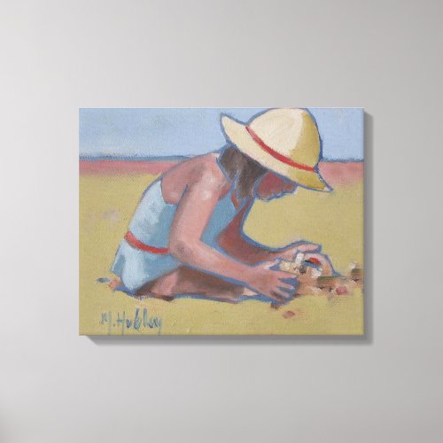 Cute little girl playing in sand canvas print