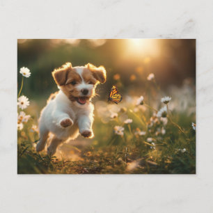 Cute little puppy chasing after a butterfly postcard