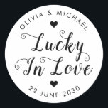 Cute Lucky in Love Thank You Sweet Wedding Favor Classic Round Sticker<br><div class="desc">A Classic Black Wedding Favor Label Sticker featuring "Lucky in Love" in a rustic modern elegant font calligraphy and heart accents. 
You can easily personalized it with your names and wedding date.</div>