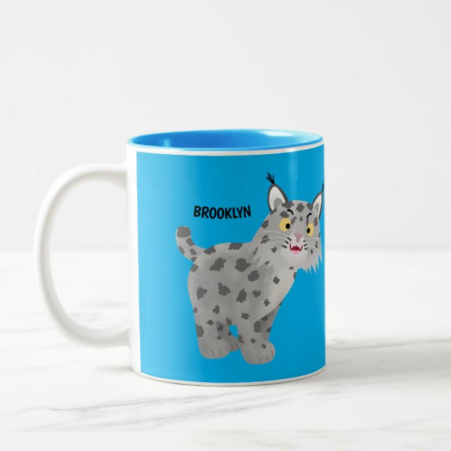 Cute mean bobcat lynx cartoon Two-Tone coffee mug (Left)