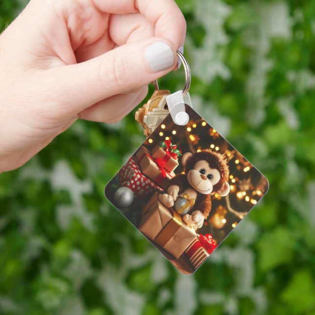 Cute monkey on a Christmas gift Keychain (Hand)