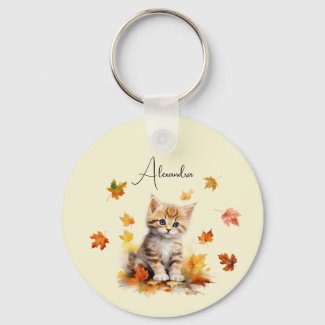 Cute Orange Tabby Kitten in Fall Leaves
