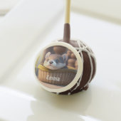 Cute otter baby in a basket - kids birthday cake pops (Front Insitu)