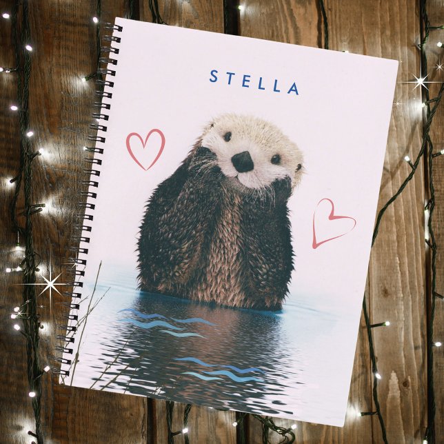 Cute Otter in Pond with Pink Background and Hearts Notebook (Personalize with a name. Available in many styles and many types of interiors.)