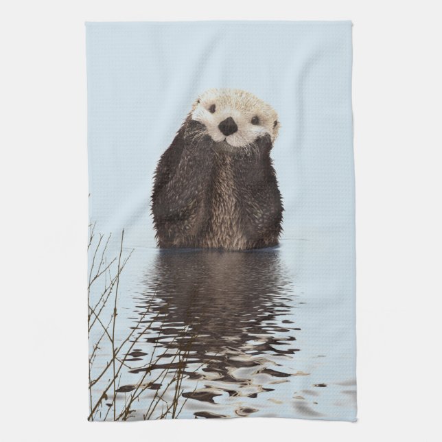 Cute Otter Standing in a Pond Holding his Face Towel (Vertical)