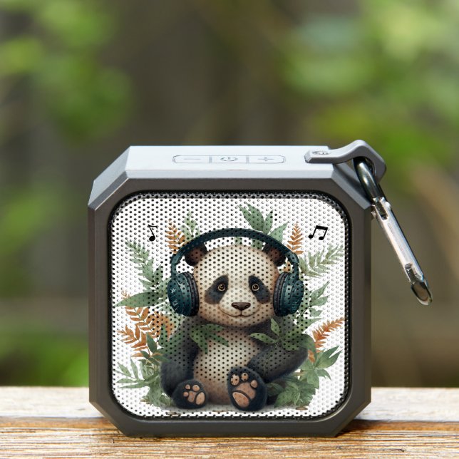 Cute panda wearing headphone, surrounded by leaves bluetooth speaker