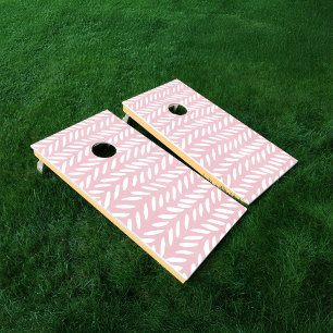 Cute pastel herringbone pattern on pink cornhole set