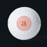 Cute Pastel Pink Orange Monogram Retro Lettering Golf Balls<br><div class="desc">These stylish golf balls feature your monogram in coral on a pastel pink background in retro lettering. Great gift idea!</div>