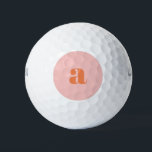 Cute Pastel Pink Orange Monogram Retro Lettering Golf Balls<br><div class="desc">These stylish golf balls feature your monogram in coral on a pastel pink background in retro lettering. Great gift idea!</div>