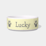 Cute Pastel Yellow and Gray Paw Print Pet Bowl<br><div class="desc">Cute pet bowl with your pet's name along with a paw print on either side in gray over a pastel yellow background.  This simple and fun pet bowl makes a great gift for a dog or cat lover.</div>