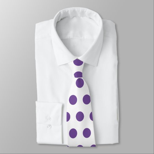 Cute pattern of large purple polka dots on white neck tie