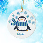 Cute Personalized Penguin Blue Snowflake Christmas Ceramic Ornament<br><div class="desc">A pretty penguin in a cool blue striped winter scarf under beautiful blue snowflakes. Customize this cute holiday gift with a friend's name for an adorable personalized Christmas ornament.</div>