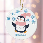 Cute Personalized Penguin Pink Scarf Christmas Ceramic Ornament<br><div class="desc">A pretty penguin in a pink winter scarf under beautiful blue snowflakes. Customize this cute holiday gift with a friend's name for an adorable personalized Christmas ornament.</div>